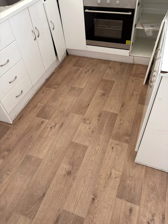 New timber-look hybrid flooring in a Melbourne rental property kitchen